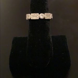 Baguette and round stone ring